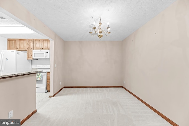 23140 Cobblestone Ln Unit 109, California, MD 20619 - kitchen featuring white appliances, a chandelier, light carpet, baseboards, and a textured ceiling