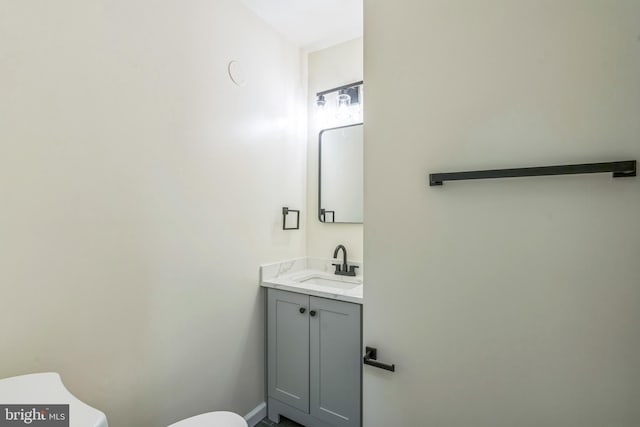 13029 Clarion Rd, Fort Washington, MD 20744 - bathroom with toilet, vanity, and baseboards