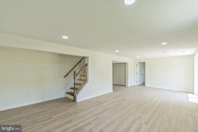 13029 Clarion Rd, Fort Washington, MD 20744 - unfurnished living room with light wood-style flooring, stairs, baseboards, and recessed lighting