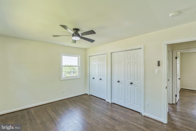 13029 Clarion Rd, Fort Washington, MD 20744 - unfurnished bedroom featuring two closets, wood finished floors, baseboards, and a ceiling fan