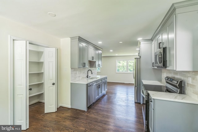 13029 Clarion Rd, Fort Washington, MD 20744 - kitchen featuring appliances with stainless steel finishes, gray cabinetry, a sink, recessed lighting, and dark wood-style floors
