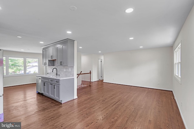 13029 Clarion Rd, Fort Washington, MD 20744 - unfurnished living room with a sink, baseboards, wood finished floors, and recessed lighting