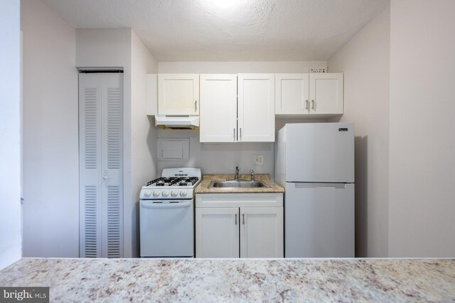 1836 Metzerott Rd Unit T-15, Hyattsville, MD 20783 - kitchen featuring white appliances, under cabinet range hood, a sink, and white cabinets