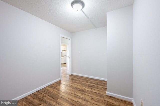1836 Metzerott Rd Unit T-15, Hyattsville, MD 20783 - spare room with wood finished floors, baseboards, and a textured ceiling