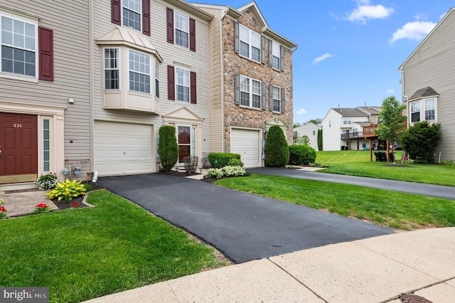 233 Windsor Ct, Quakertown, PA 18951 - multi unit property with stone siding, a garage, and asphalt driveway