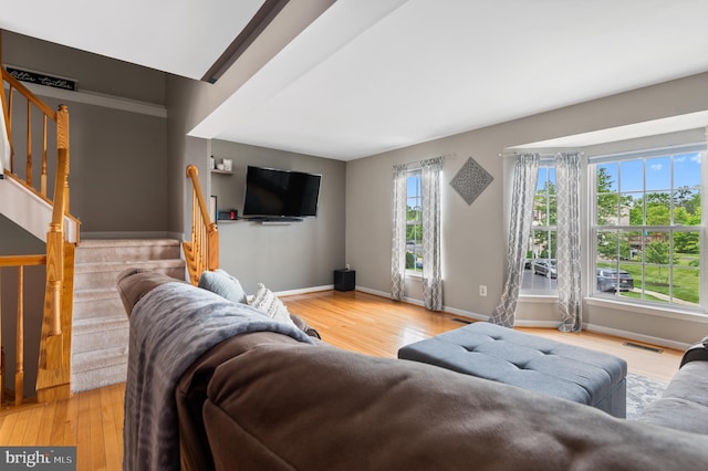 233 Windsor Ct, Quakertown, PA 18951 - living area with stairs, wood finished floors, and baseboards