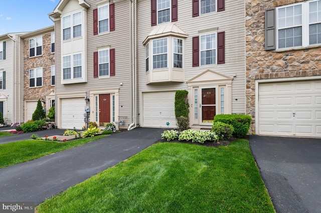 233 Windsor Ct, Quakertown, PA 18951 - multi unit property featuring stone siding, driveway, and a garage