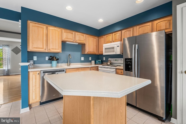 233 Windsor Ct, Quakertown, PA 18951 - kitchen featuring stainless steel appliances, a sink, light countertops, light tile patterned floors, and recessed lighting