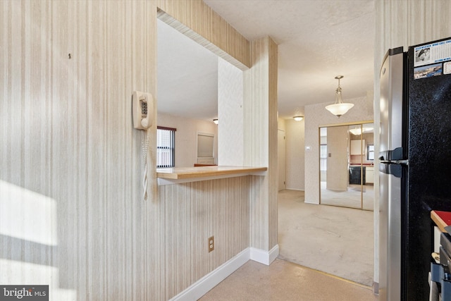 9363 Neil Rd Unit A, Philadelphia, PA 19115 - kitchen with freestanding refrigerator, carpet, baseboards, and pendant lighting