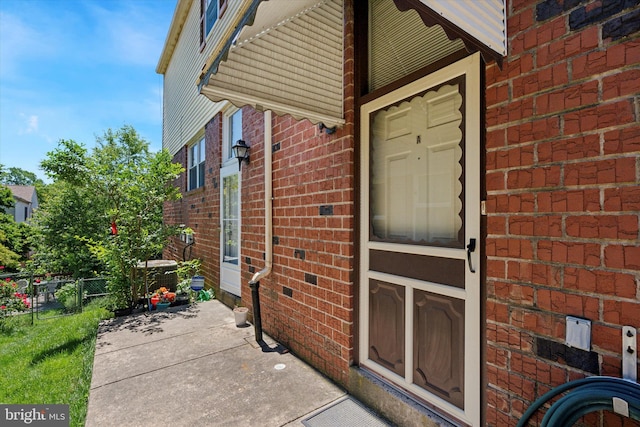9363 Neil Rd Unit A, Philadelphia, PA 19115 - property entrance with brick siding and central air condition unit