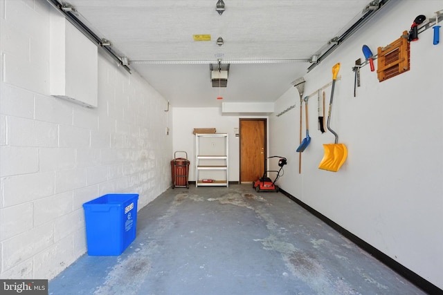 9363 Neil Rd Unit A, Philadelphia, PA 19115 - garage featuring concrete block wall and a garage door opener