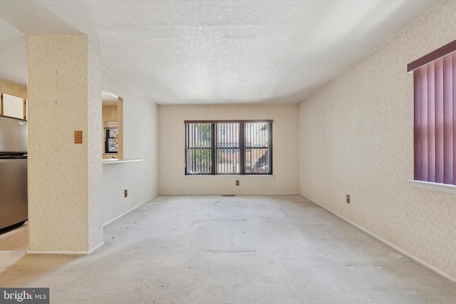 9363 Neil Rd Unit A, Philadelphia, PA 19115 - carpeted empty room featuring a textured ceiling