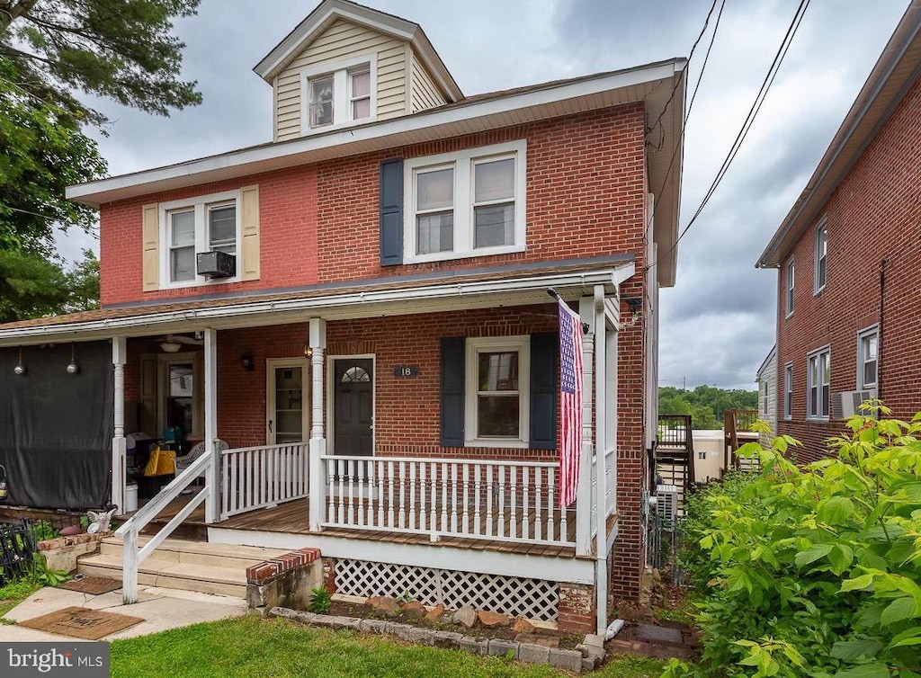 18 New Rd, Aston, PA 19014 - view of front facade with brick siding, covered porch, and cooling unit