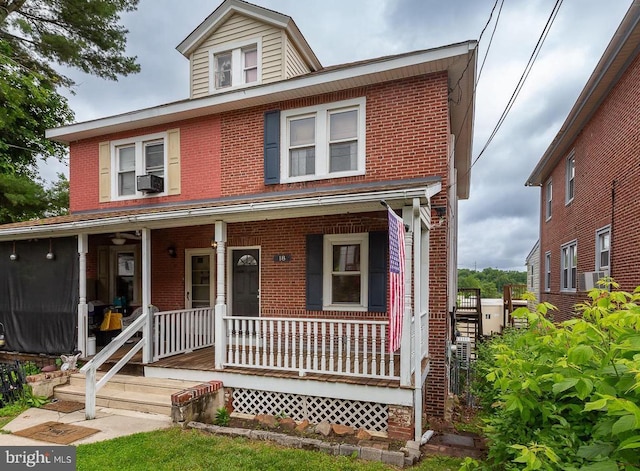18 New Rd, Aston, PA 19014 - view of front facade with brick siding, covered porch, and cooling unit