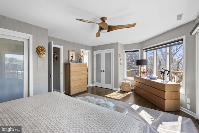 2186 Chesapeake Harbour Dr E, Annapolis, MD 21403 - bedroom featuring dark wood finished floors, baseboards, a ceiling fan, and french doors