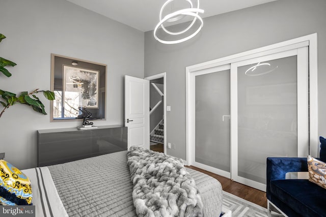 2186 Chesapeake Harbour Dr E, Annapolis, MD 21403 - bedroom with wood finished floors, a chandelier, and a closet