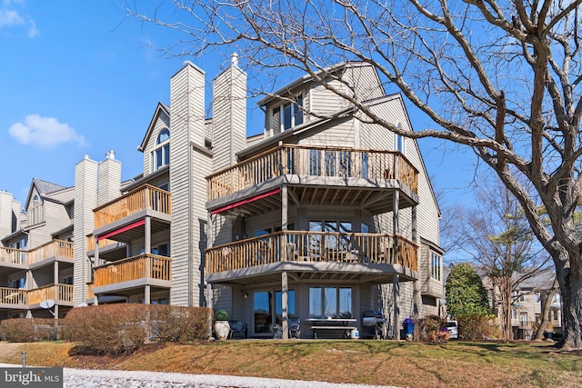 2186 Chesapeake Harbour Dr E, Annapolis, MD 21403 - rear view of property with a balcony and a yard