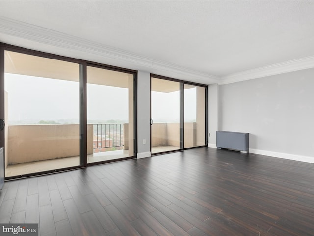 4141 N Henderson Rd N Unit 809, Arlington, VA 22203 - unfurnished room with plenty of natural light, crown molding, wood finished floors, expansive windows, and baseboards