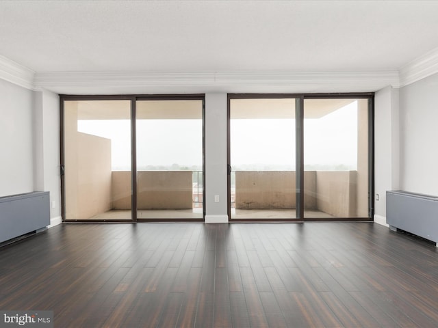 4141 N Henderson Rd N Unit 809, Arlington, VA 22203 - unfurnished room with expansive windows, ornamental molding, healthy amount of natural light, dark wood-type flooring, and radiator heating unit