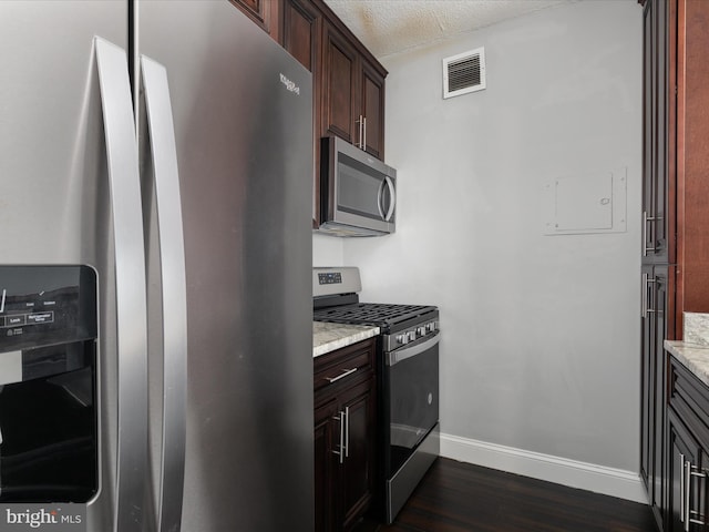 4141 N Henderson Rd N Unit 809, Arlington, VA 22203 - kitchen featuring stainless steel appliances, dark wood-style floors, baseboards, and light stone counters