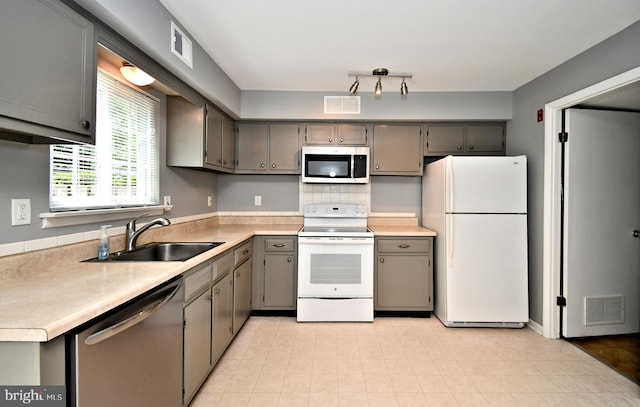 313 Christopher Ct, Lansdale, PA 19446 - kitchen featuring appliances with stainless steel finishes, a sink, gray cabinets, and light countertops