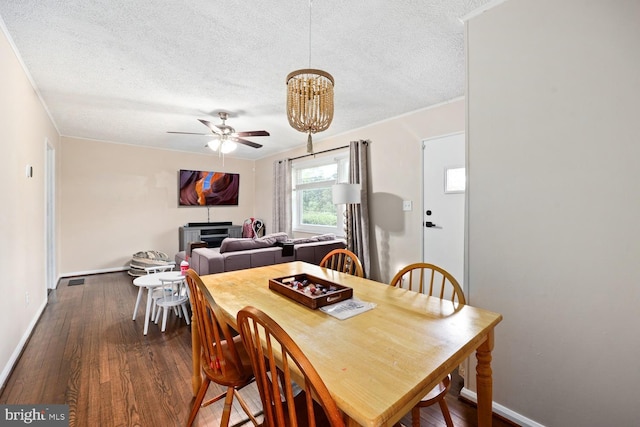 35 Holly Corner Rd, Fredericksburg, VA 22406 - dining space with a textured ceiling, baseboards, dark wood-style flooring, a chandelier, and ceiling fan
