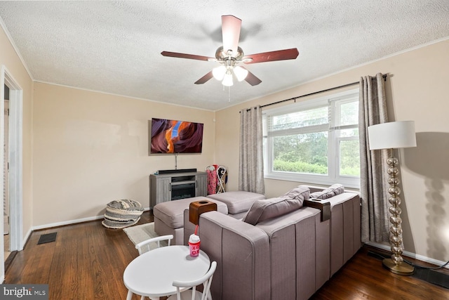 35 Holly Corner Rd, Fredericksburg, VA 22406 - living area with a ceiling fan, baseboards, dark wood-type flooring, a textured ceiling, and ornamental molding