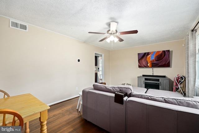 35 Holly Corner Rd, Fredericksburg, VA 22406 - living area with dark wood-style floors, ceiling fan, ornamental molding, baseboards, and a textured ceiling