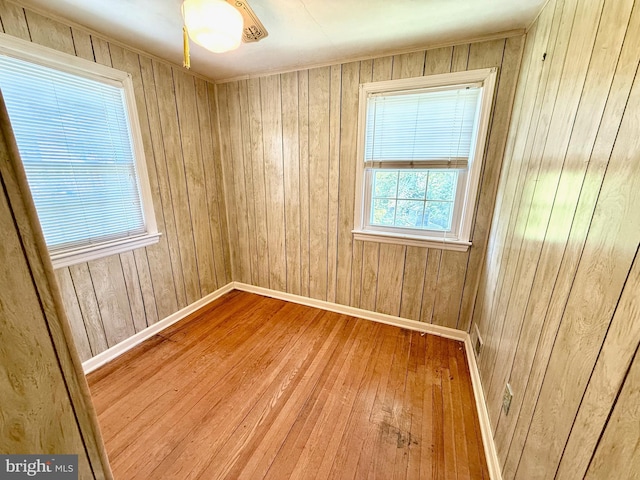 9733 Narragansett Pkwy, College Park, MD 20740 - unfurnished room with wood-type flooring, baseboards, and wood walls