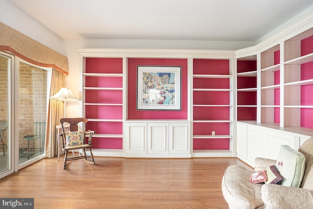 3801 Canterbury Rd Unit 817, Baltimore, MD 21218 - sitting room with wood finished floors and built in shelves