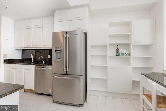 3801 Canterbury Rd Unit 817, Baltimore, MD 21218 - kitchen featuring stainless steel appliances, open shelves, white cabinetry, and light tile patterned flooring