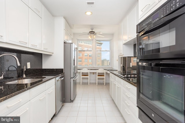 3801 Canterbury Rd Unit 817, Baltimore, MD 21218 - kitchen with black appliances, a sink, white cabinetry, and recessed lighting