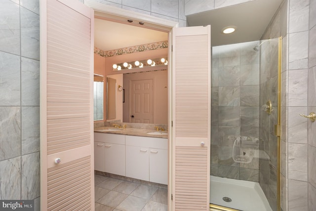 3801 Canterbury Rd Unit 817, Baltimore, MD 21218 - full bathroom with a stall shower, double vanity, and tile patterned floors