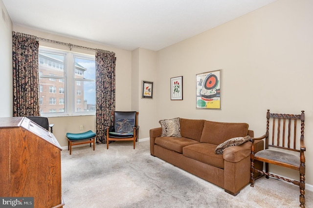 3801 Canterbury Rd Unit 817, Baltimore, MD 21218 - carpeted living room with baseboards