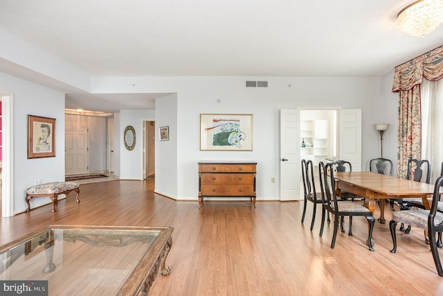 3801 Canterbury Rd Unit 817, Baltimore, MD 21218 - dining room with light wood-style floors and baseboards