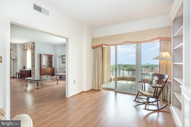 3801 Canterbury Rd Unit 817, Baltimore, MD 21218 - living area featuring wood finished floors and baseboards
