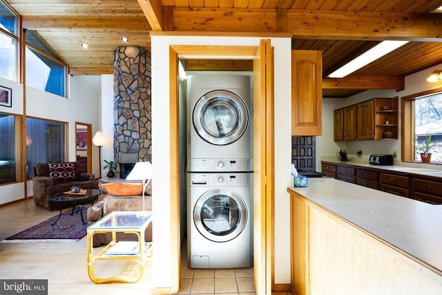 105 Fern Creek Ln, Martinsburg, WV 25404 - washroom with stacked washer / drying machine, wood ceiling, light wood-type flooring, and a sink