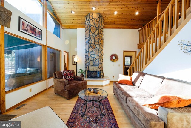 105 Fern Creek Ln, Martinsburg, WV 25404 - living room with wooden ceiling, a towering ceiling, wood finished floors, stairway, and baseboards
