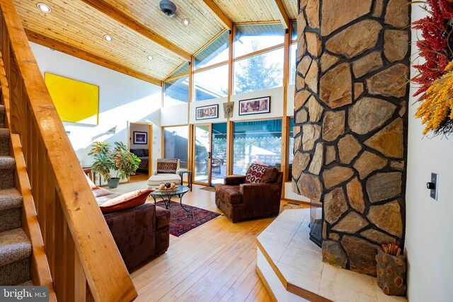 105 Fern Creek Ln, Martinsburg, WV 25404 - living room featuring high vaulted ceiling, hardwood / wood-style flooring, stairs, healthy amount of natural light, and wooden ceiling with exposed beams