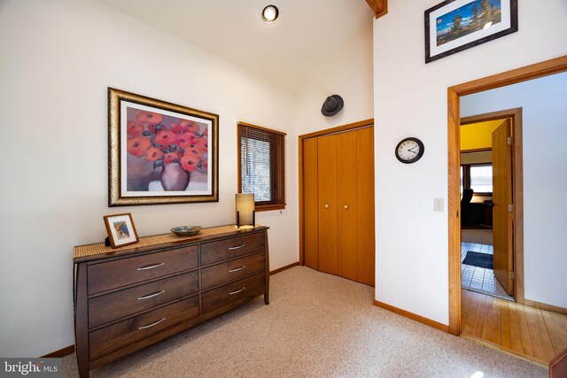 105 Fern Creek Ln, Martinsburg, WV 25404 - bedroom with baseboards, light carpet, a closet, and lofted ceiling