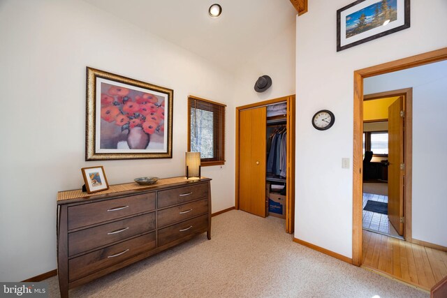105 Fern Creek Ln, Martinsburg, WV 25404 - corridor with baseboards, lofted ceiling, and light carpet