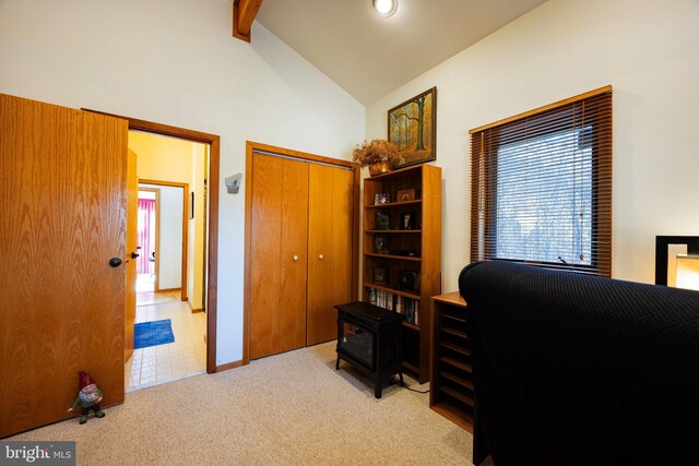 105 Fern Creek Ln, Martinsburg, WV 25404 - carpeted home office with a wood stove, beam ceiling, and high vaulted ceiling