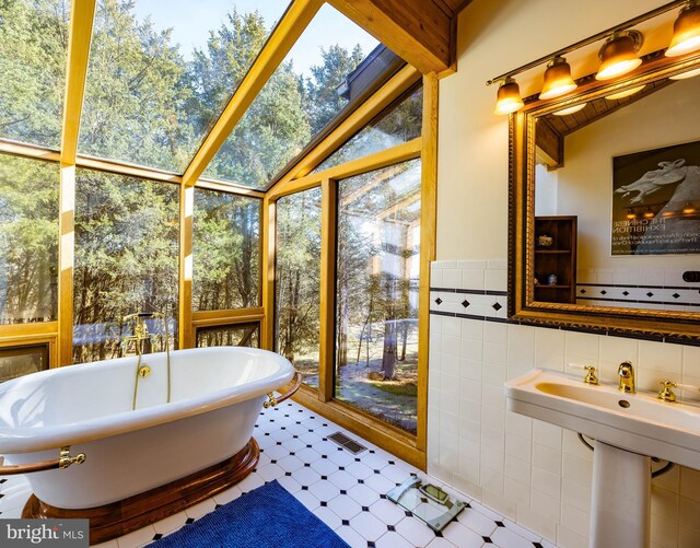 105 Fern Creek Ln, Martinsburg, WV 25404 - bathroom featuring a freestanding tub and tile patterned floors