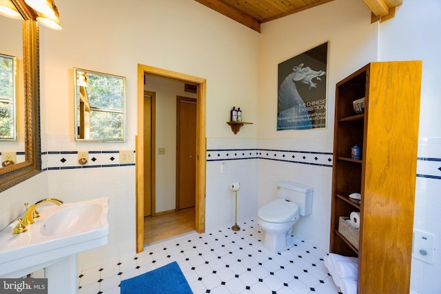 105 Fern Creek Ln, Martinsburg, WV 25404 - bathroom with tile walls, wood ceiling, plenty of natural light, tile patterned floors, and wainscoting