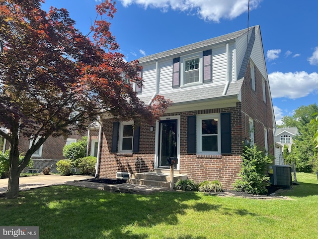 1537 W High St, Haddon Heights, NJ 08035 - view of front of home with brick siding, central AC unit, and a front lawn