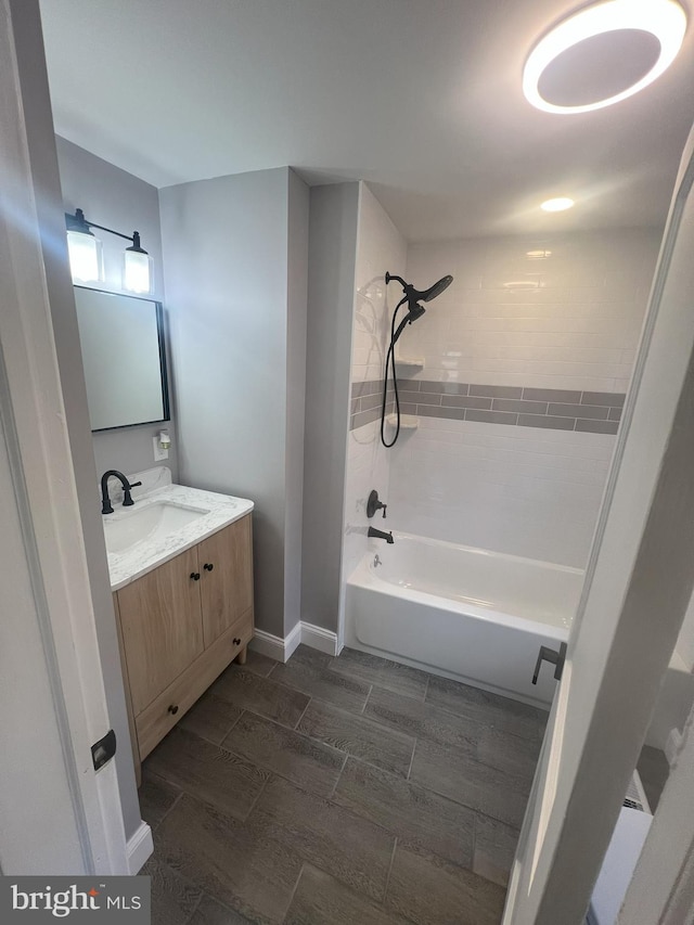 1537 W High St, Haddon Heights, NJ 08035 - full bath with wood finish floors, vanity, shower / bath combination, and baseboards