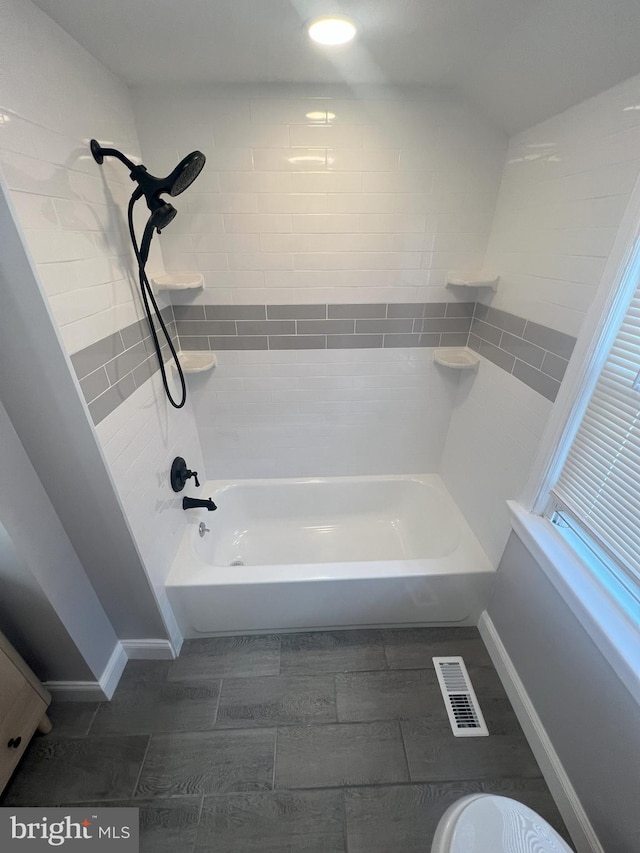 1537 W High St, Haddon Heights, NJ 08035 - bathroom with tub / shower combination, baseboards, and wood tiled floors