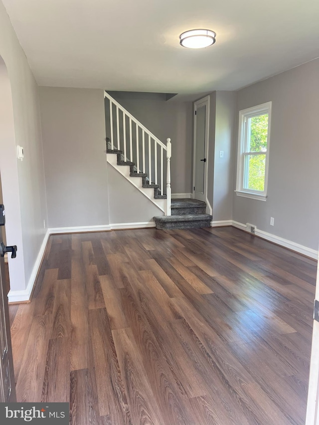 1537 W High St, Haddon Heights, NJ 08035 - foyer featuring stairway, wood finished floors, arched walkways, and baseboards