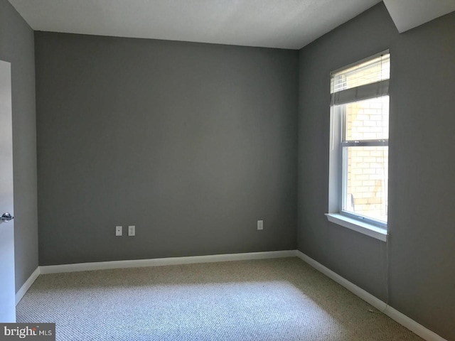 1111 11th St NW Unit 307, Washington, DC 20001 - empty room featuring plenty of natural light, carpet flooring, and baseboards