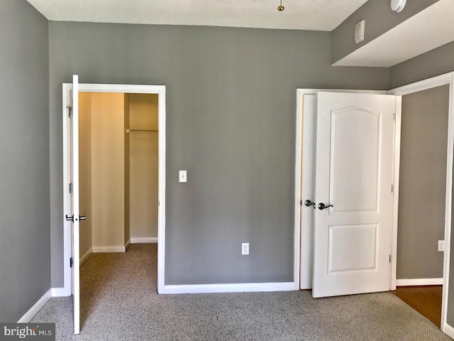 1111 11th St NW Unit 307, Washington, DC 20001 - unfurnished bedroom featuring carpet and baseboards